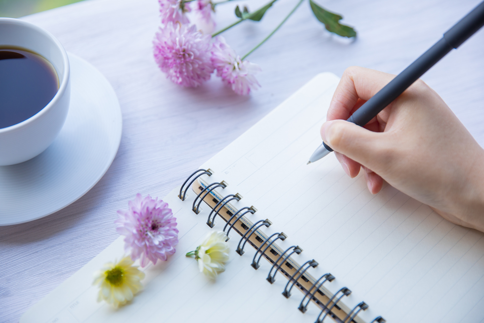woman writing in notebook