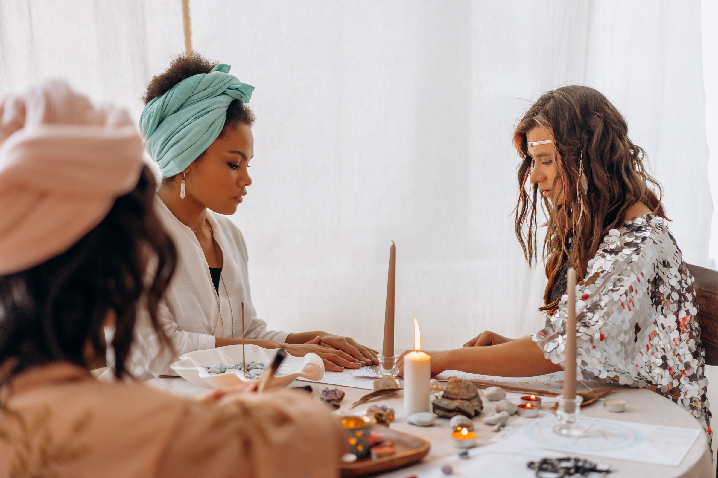 Woman in White Dress Shirt Sitting Beside Woman in White Dress Shirt